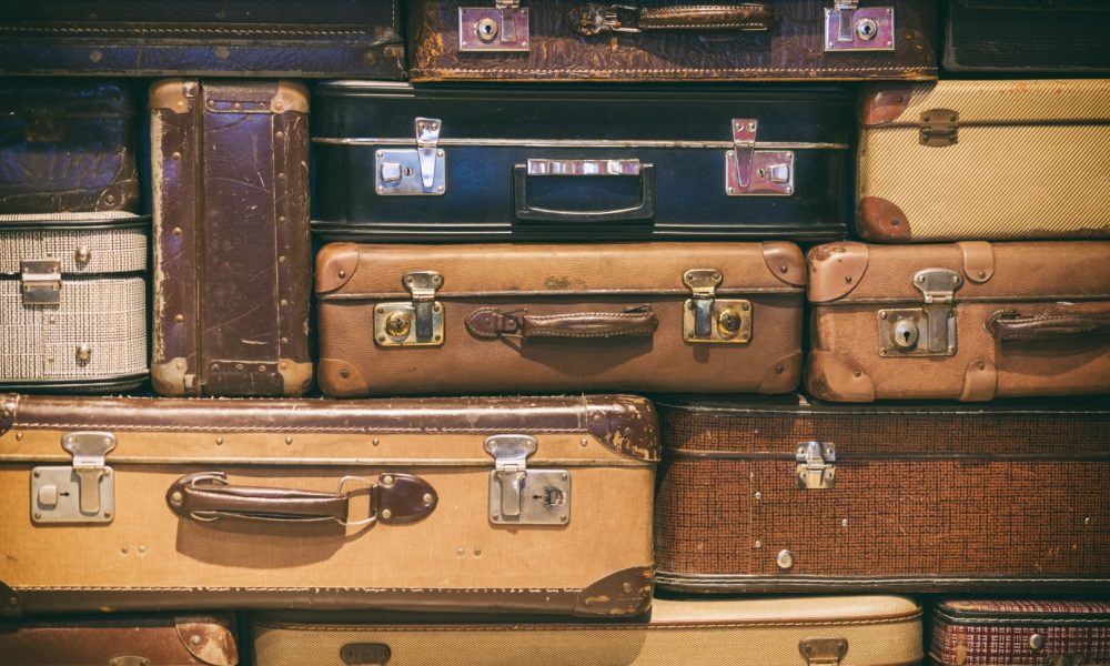 Antique suitcases in vintage collectible store - Leelanau Peninsula Visitors Guide