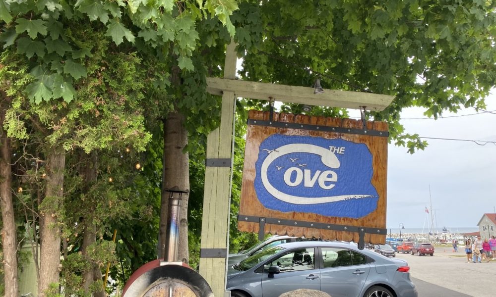 Sign out Front of The Cove in Leland Michigan - Leelanau Peninsula Visitors Guide